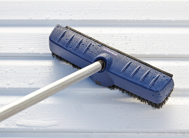 high pressure floor brush in use